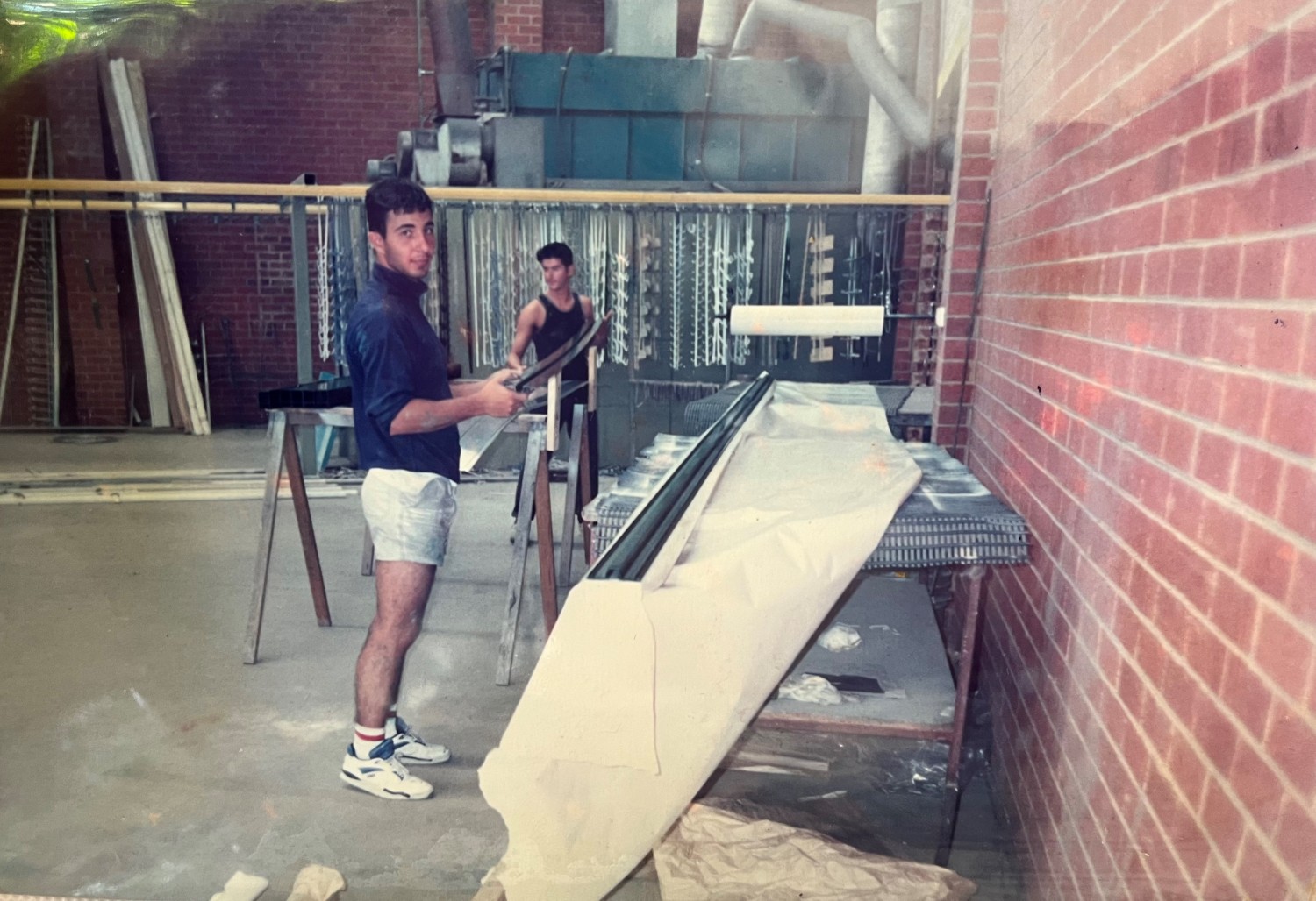 Early photo of Concept Aluminium founder working on aluminium finishing in a workshop, 1989.
